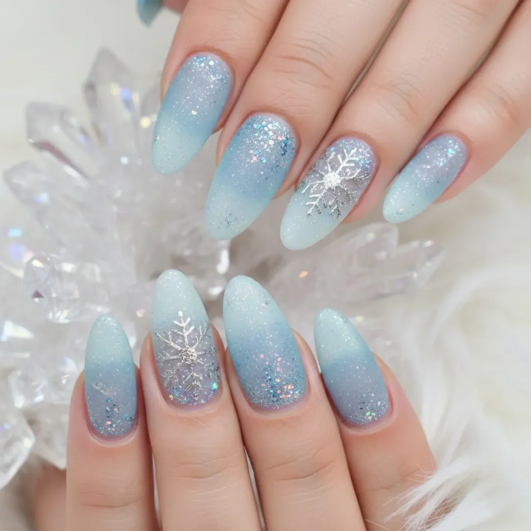 Icy Blue Fade Almond Nails With Snowflakes snowflake nail design