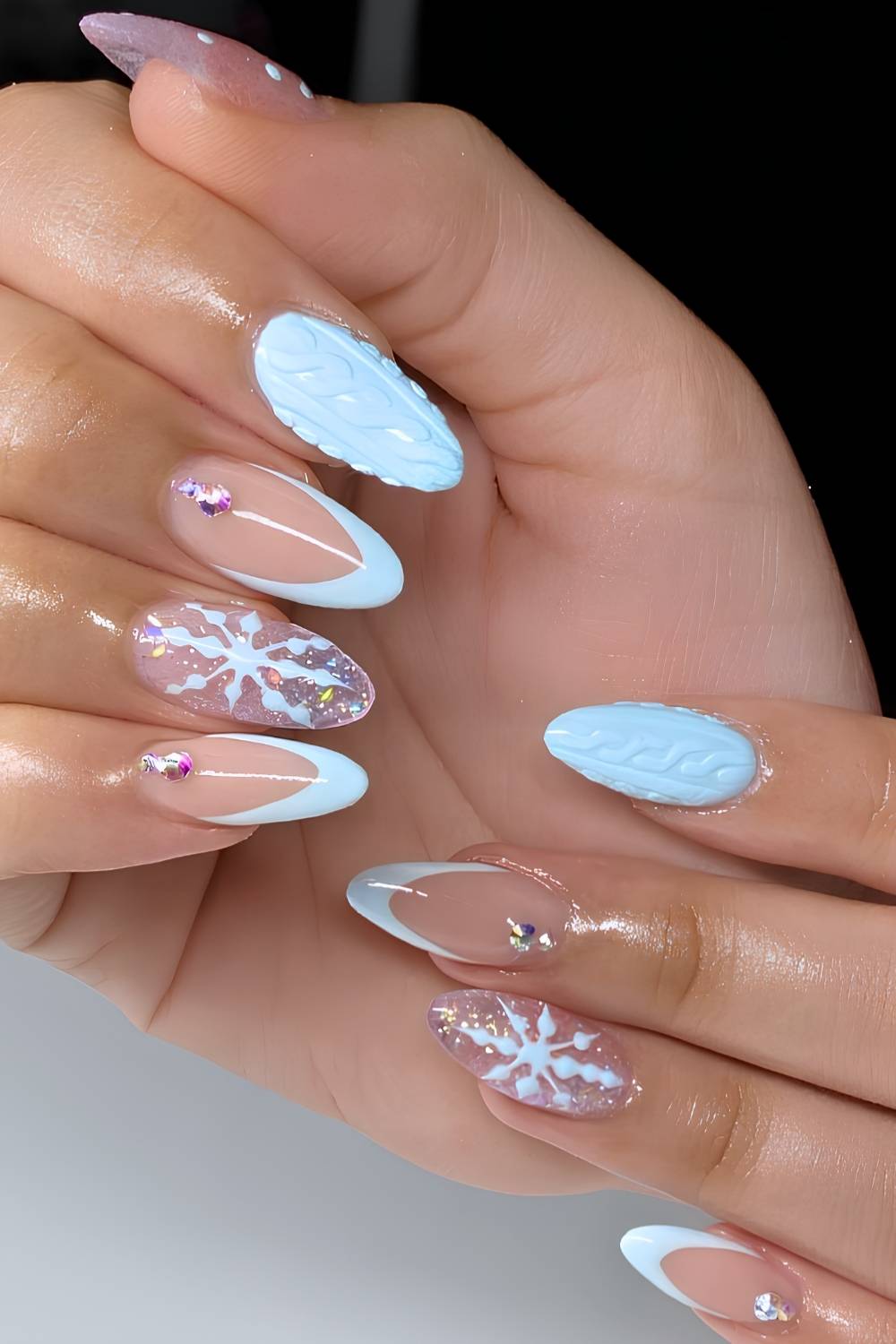 Icy Blue Snowflake Almond Nails with Gem Accents almond winter nail design