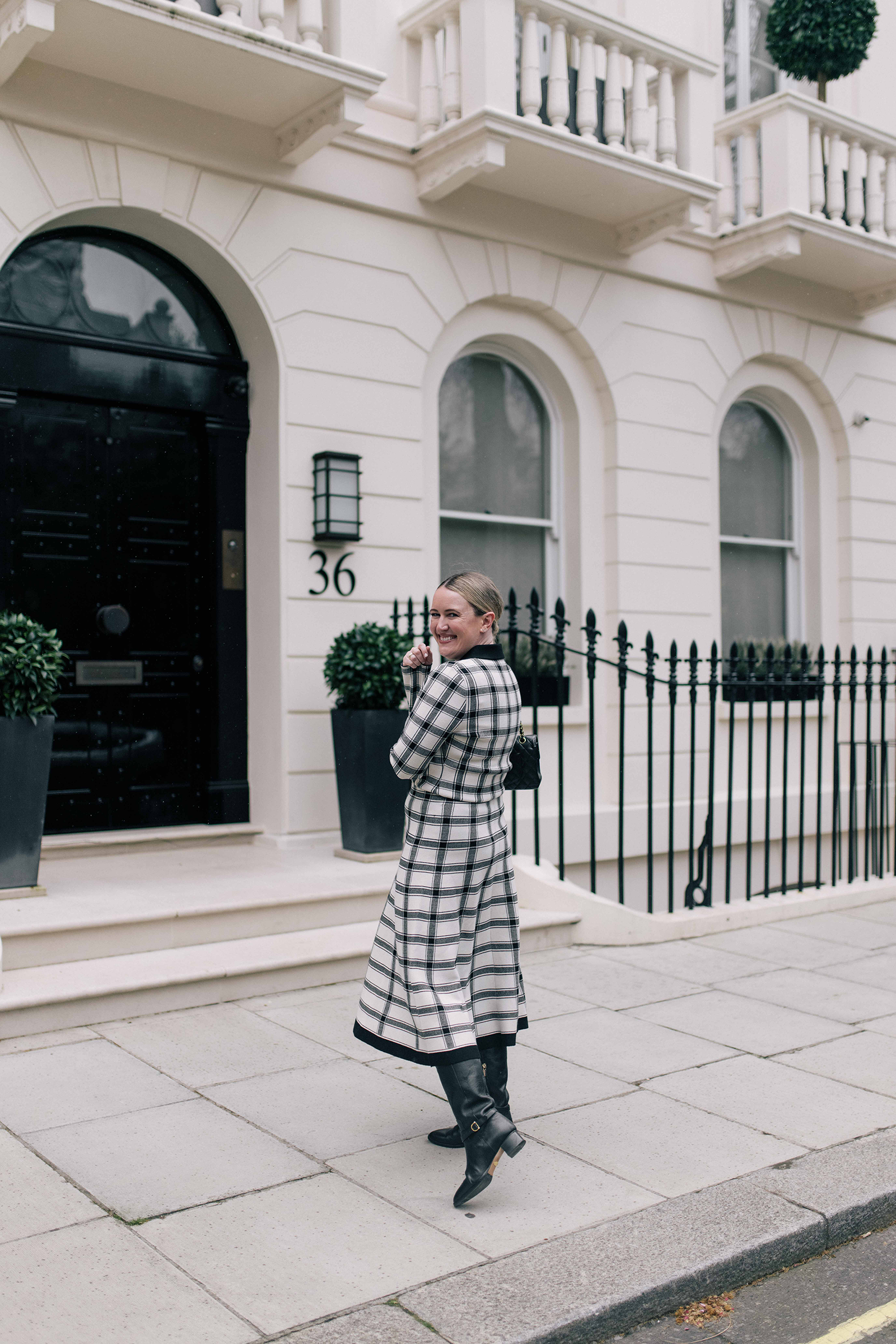 Monochromatic matching set with knee-high riding boots London outfit