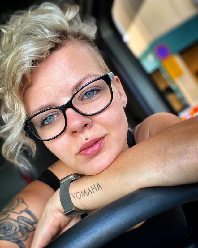 Platinum pixie with long side-swept bangs short hair hairstyle