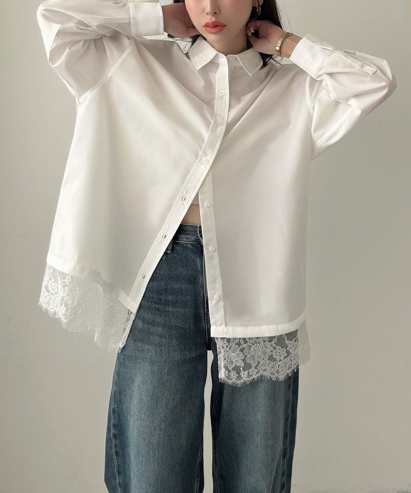 Oversized white shirt with lace trim worn over wide-leg jeans