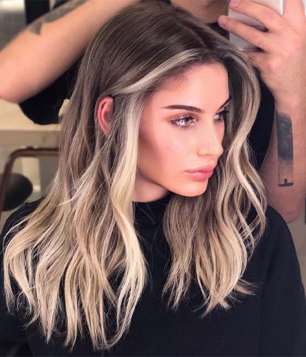 Bold Money Piece With Dark Roots hairstyle photo