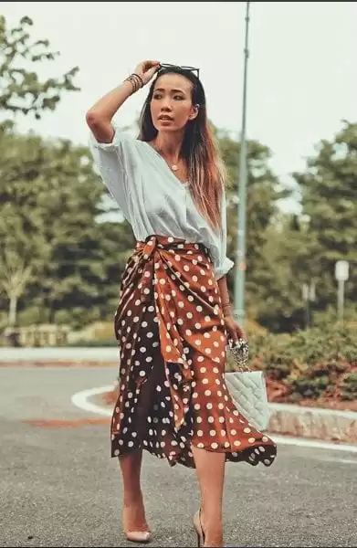 Polka-dot wrap midi skirt and white knit weekend outfit