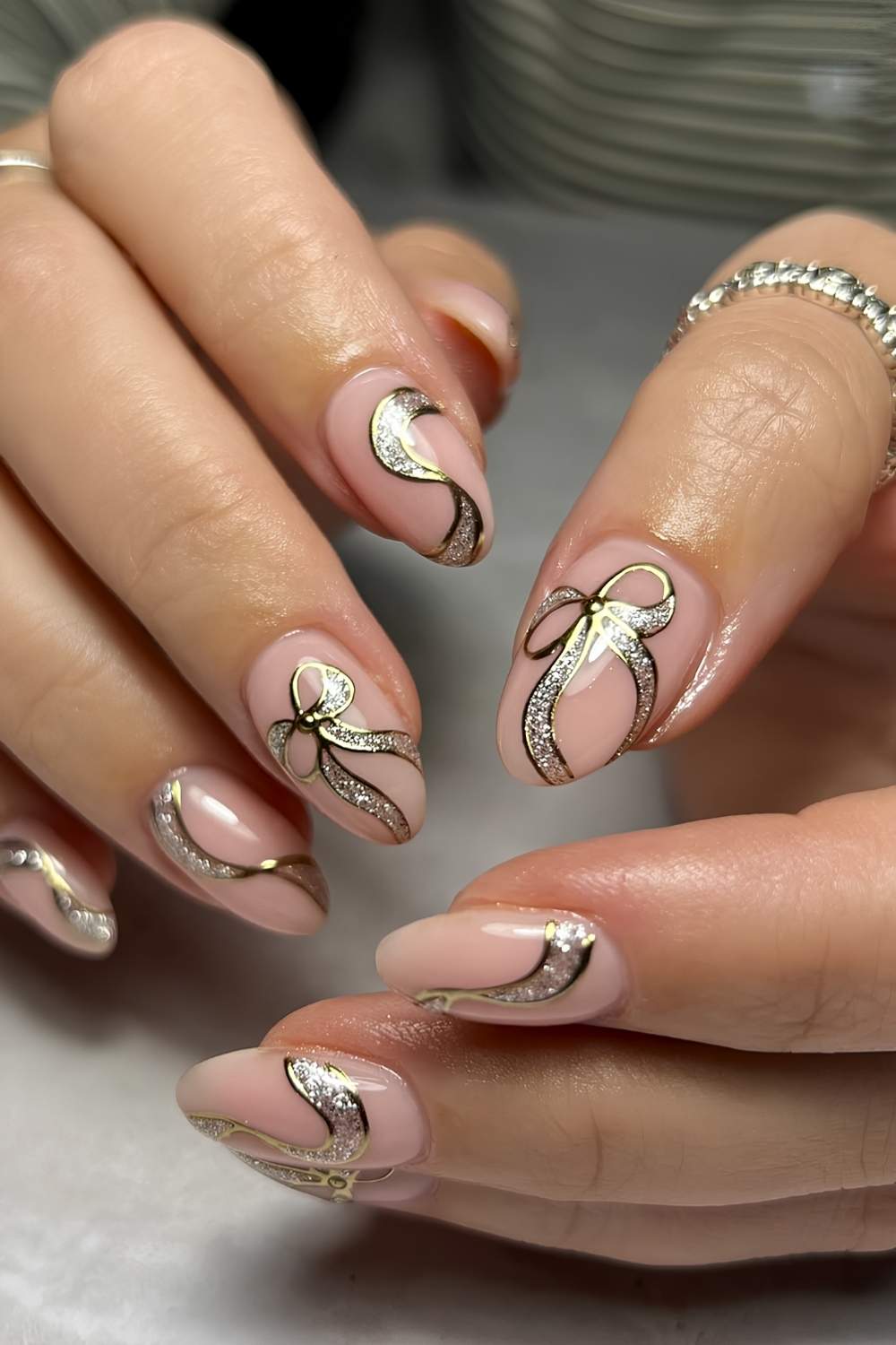 Milky Nails with Oversized Glittery Gold Bow Art holiday nails