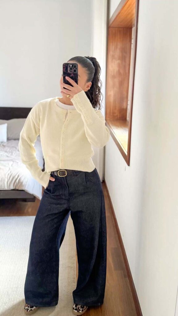 Pale yellow cardigan with dark wide-leg jeans church outfit