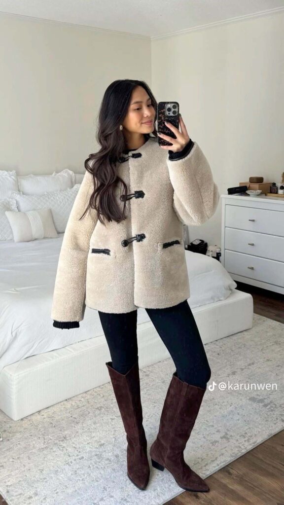 Cream shearling coat with black leggings and suede boots church outfit
