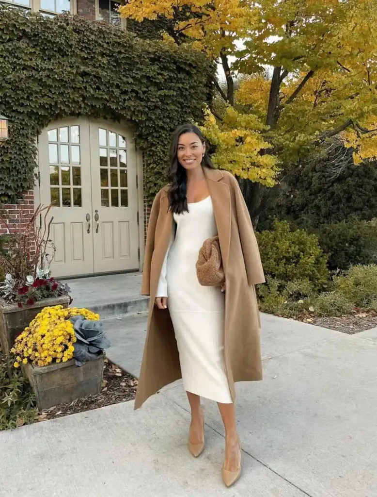 Camel overcoat with a cream midi dress and tan pumps church outfit