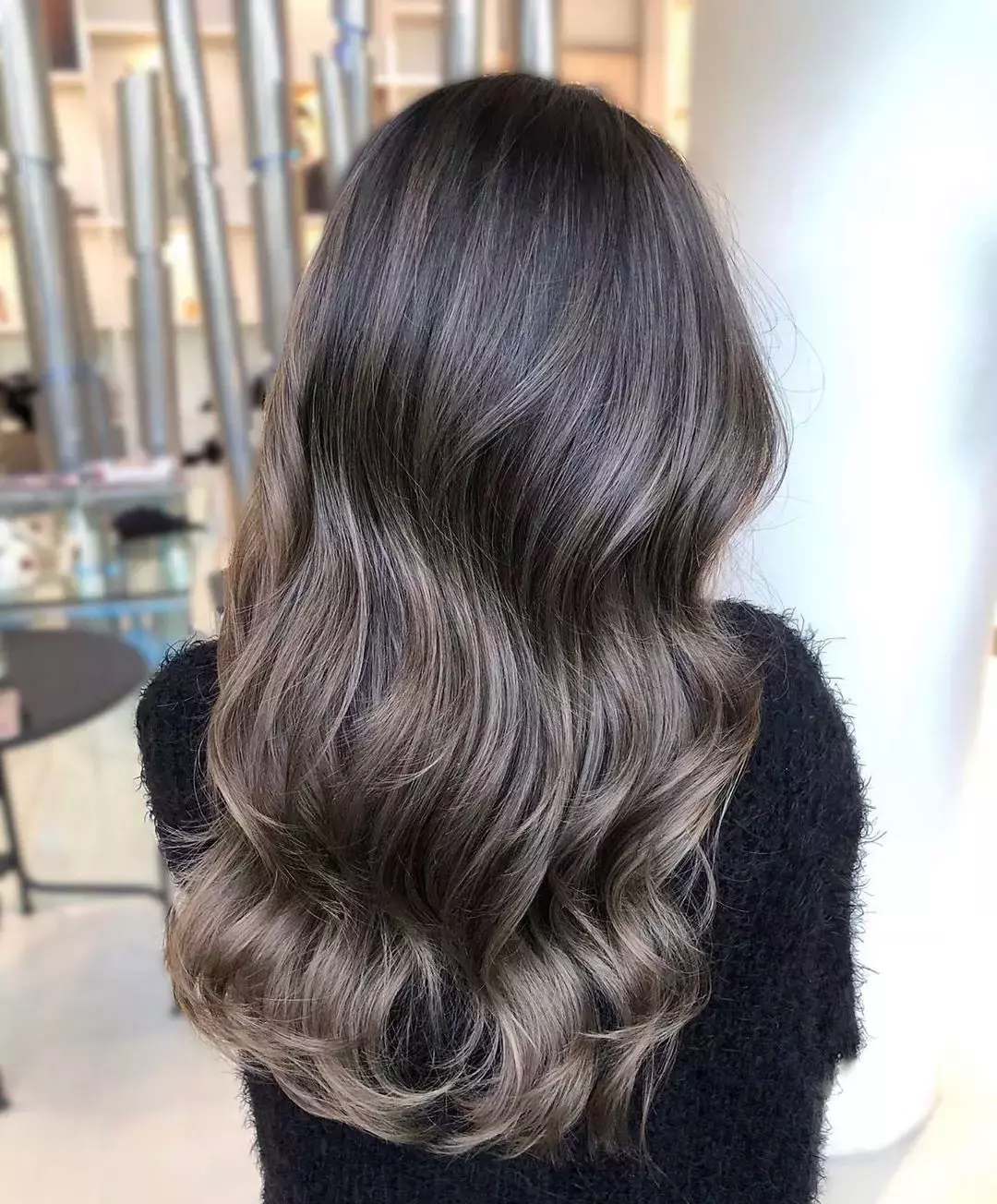 Woman with mushroom brown ash tone hair colour