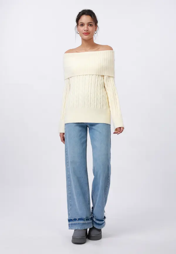 Off-the-shoulder cream sweater with light-wash jeans