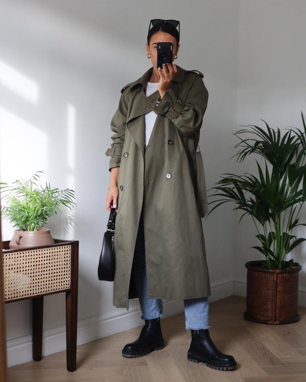 An Olive Trench Coat with a White Top and Blue Jeans casual work outfit
