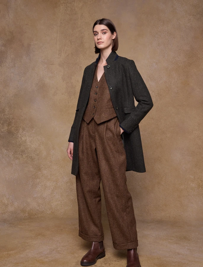 Woman in a herringbone tweed overcoat