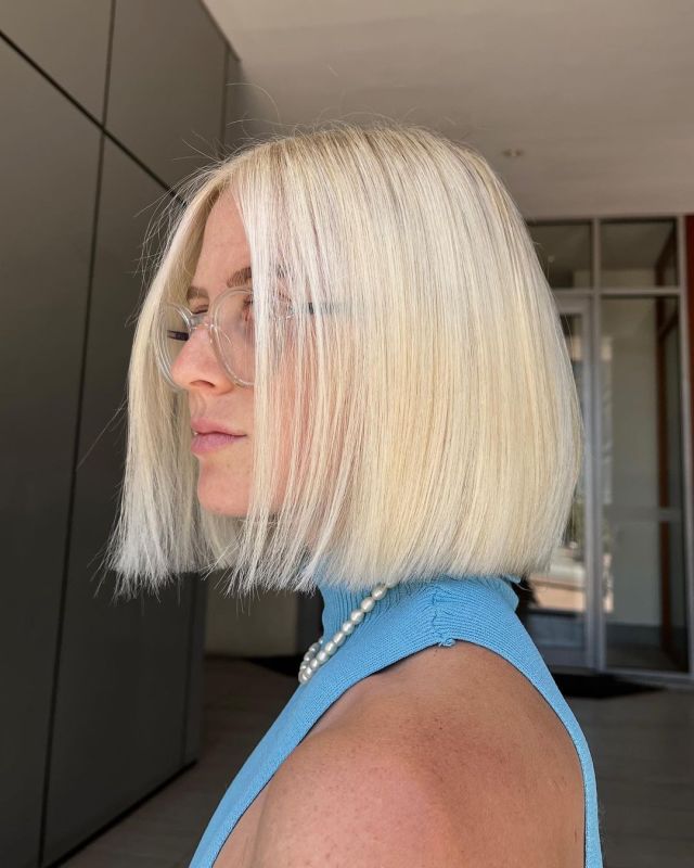 Centre-parted bob pressed pin-straight blonde short hair