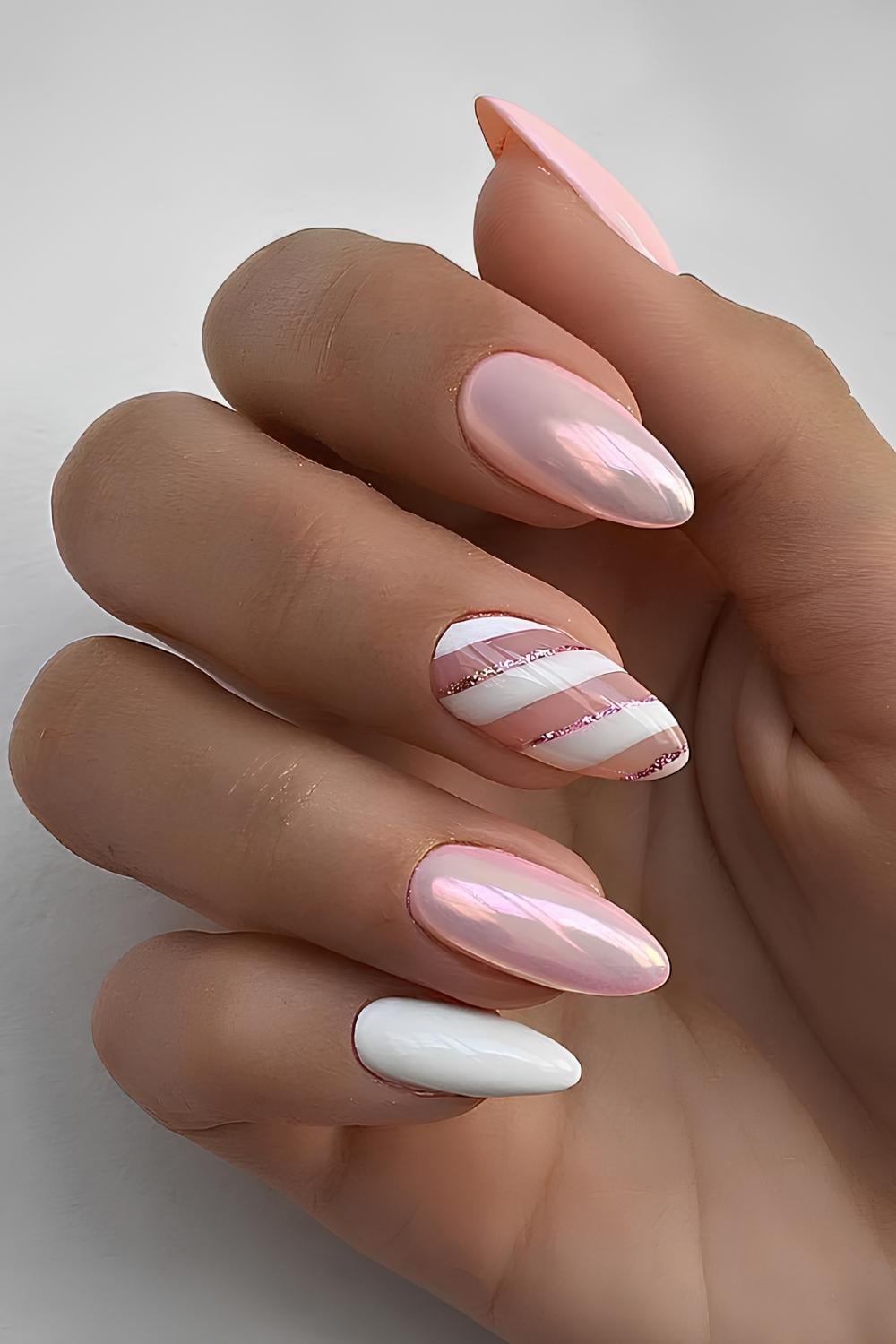 Pink Chrome Almond Nails with Candy Cane Stripes almond winter nail design