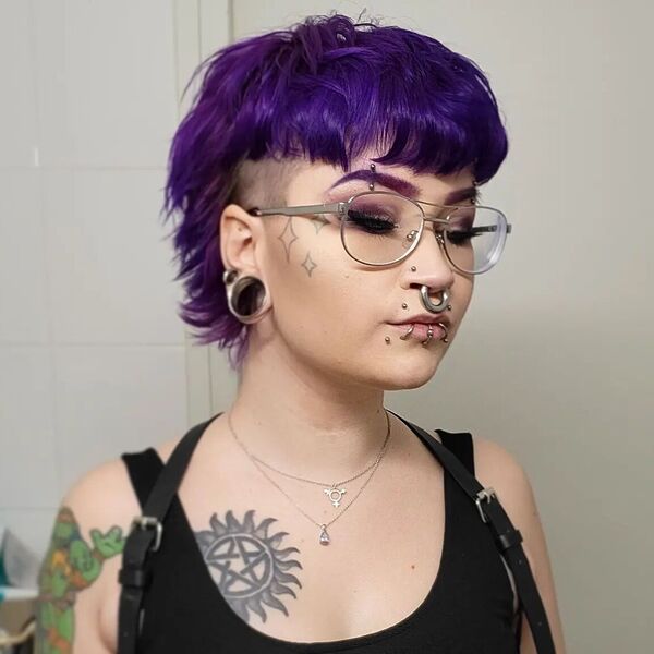 Vivid purple short mullet with an undercut around the sideburns