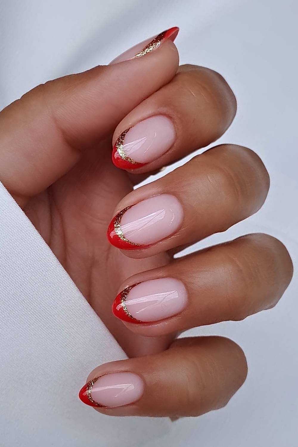 Red French Tips Outlined in Gold Glitter christmas acrylic nail design