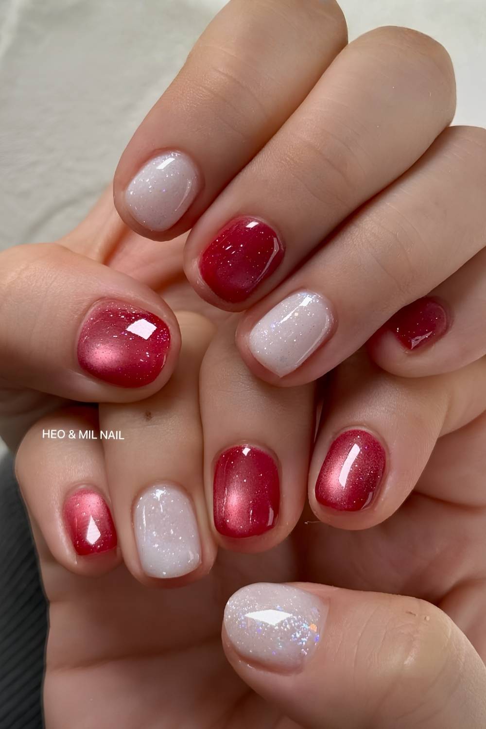 Red Cat-Eye Nails with Shimmery White Accents red and white nail design