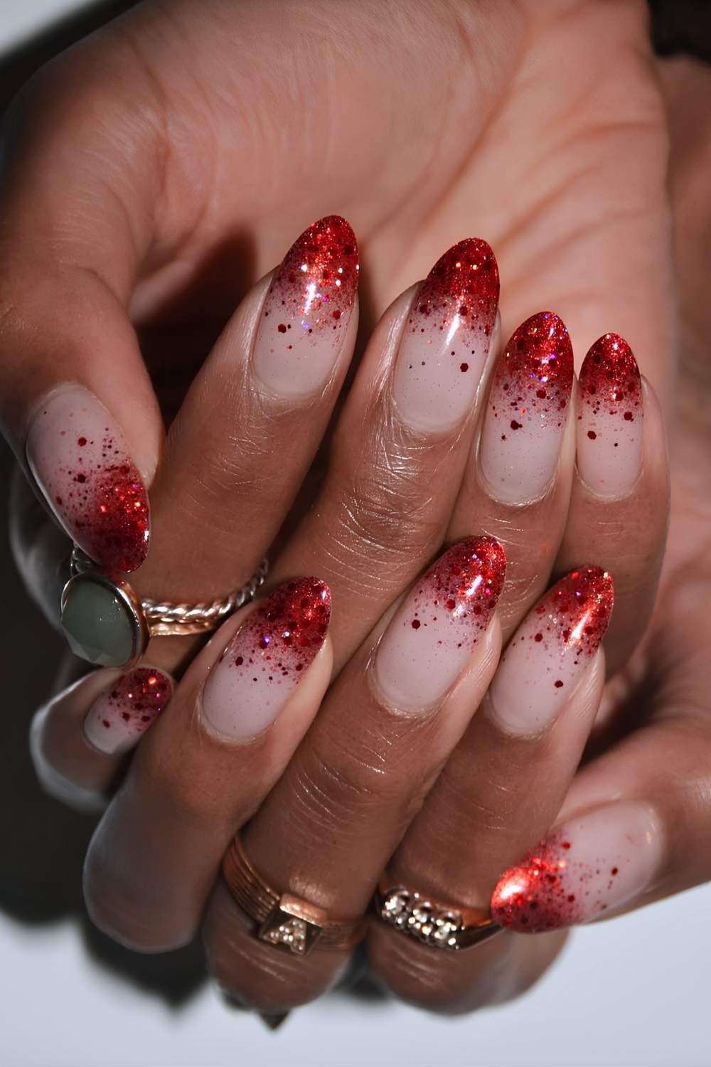 Red Glitter Fading into a Sparkling Ombre christmas acrylic nail design