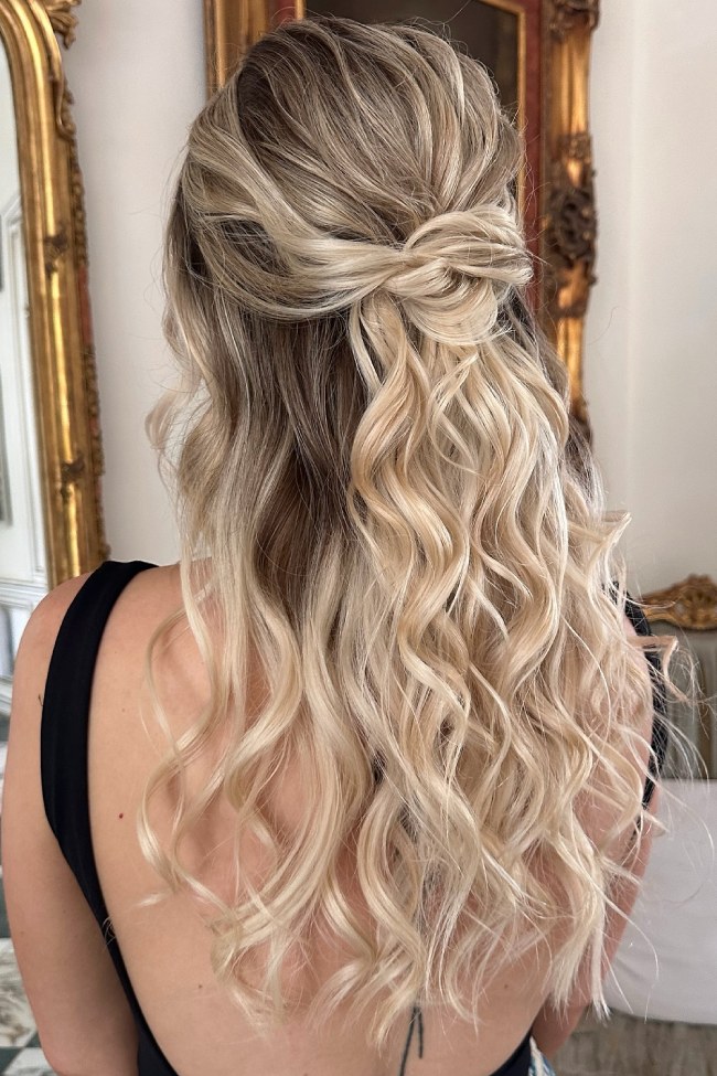 Romantic half-up knot hairstyle with loose waves
