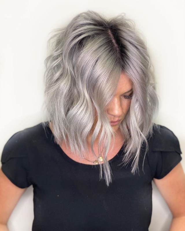 Rooted ash cut angled longer at the front blonde short hair