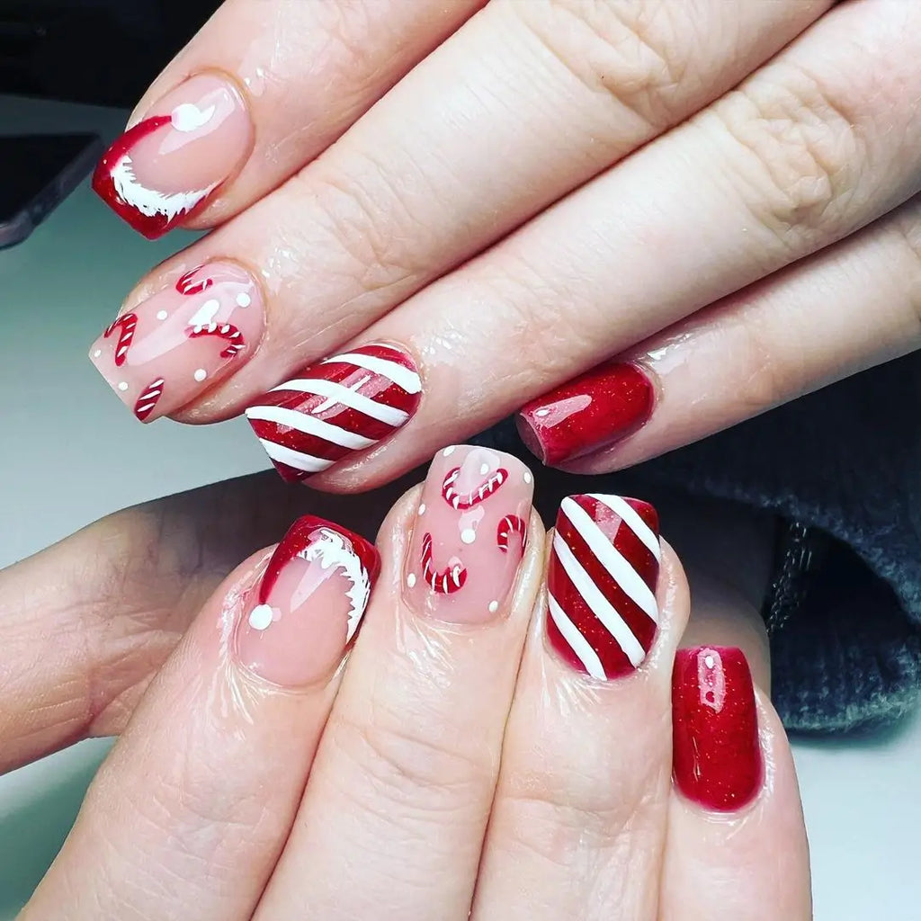 Almond Nails Mixing Santa Hats with Other Christmas Motifs santa hat nail design