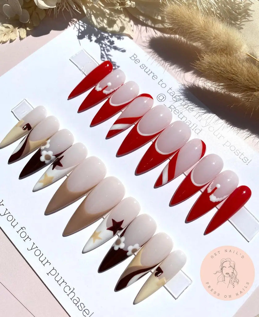 Pearlescent Beige Almond Nails with Velvet Santa Hats santa hat nail design