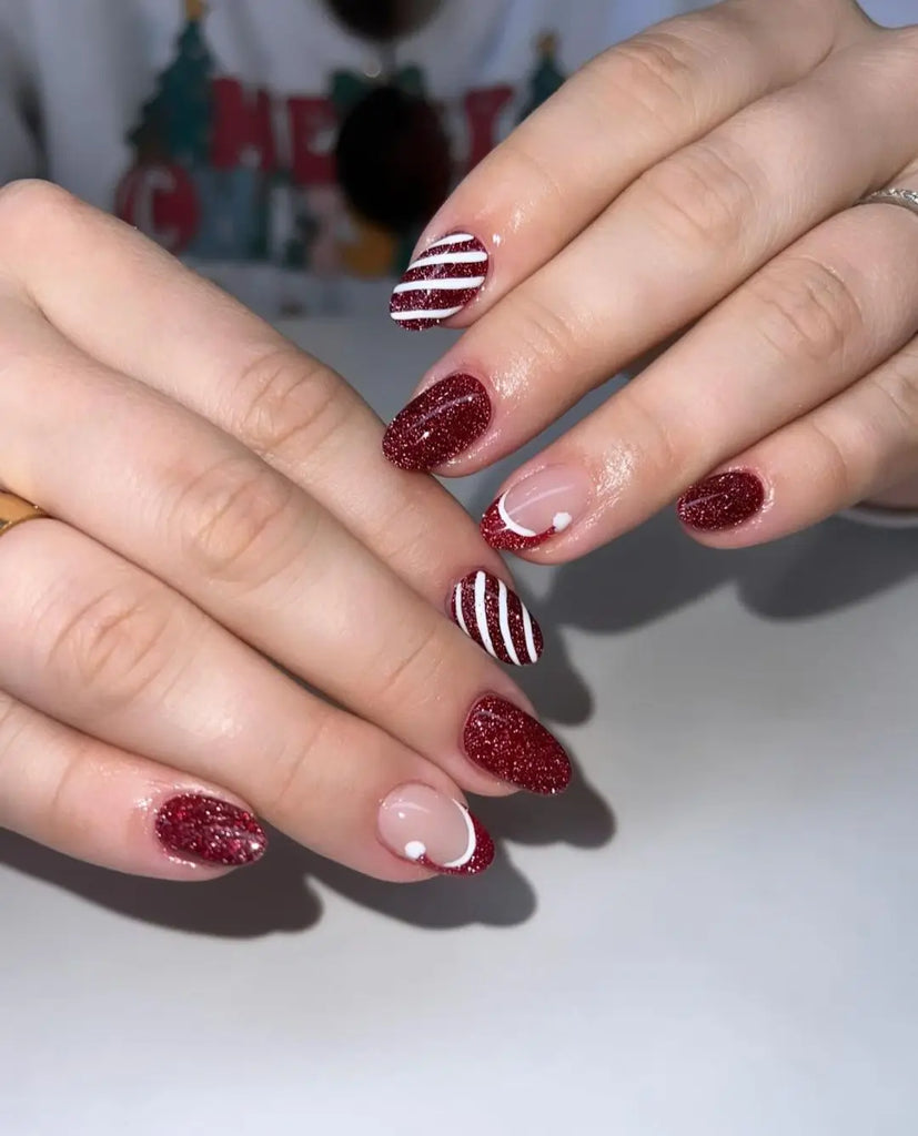 Long Almond Nails with Snowflakes and Santa Hat Trim santa hat nail design