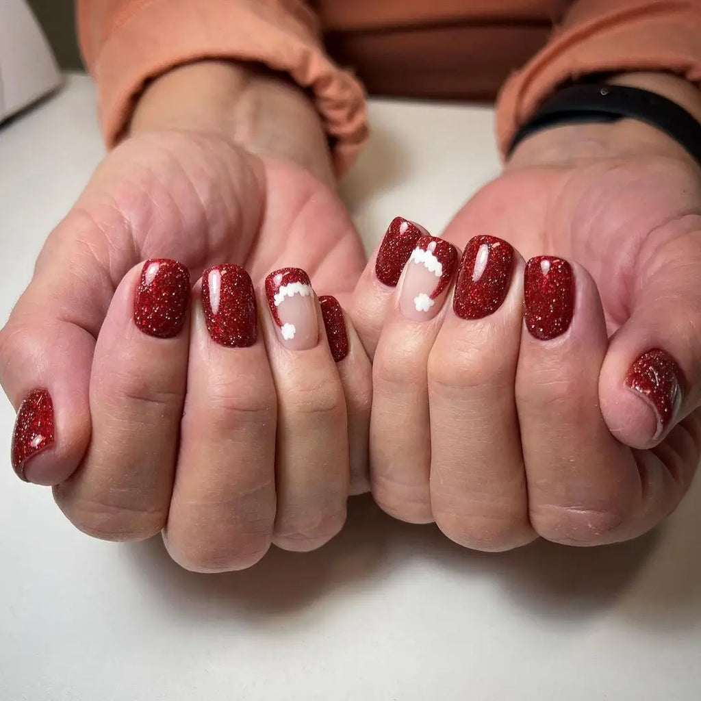 A Sculpted 3D Santa Hat on Medium Almond Nails santa hat nail design
