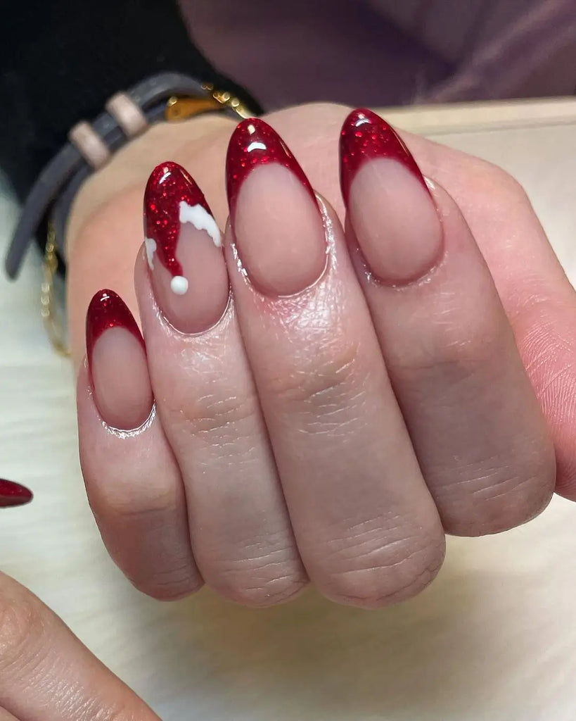 A Santa Hat Beside a Reindeer Face on Square Nails santa hat nail design