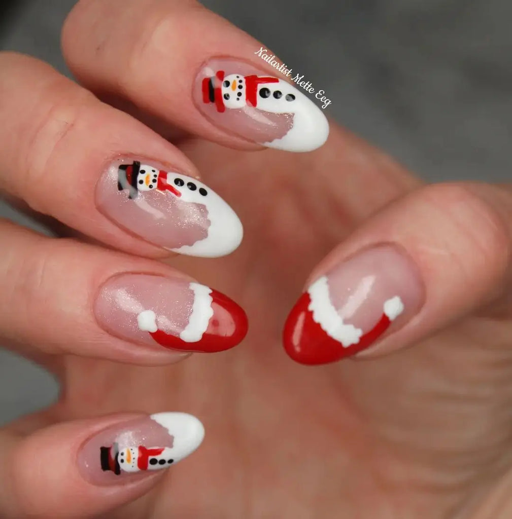 Sharp Almond Nails with a Minimal Santa Hat Trim santa hat nail design