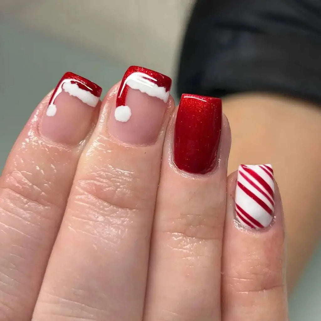 Sparkling Red Santa Hats on Short Almond Nails santa hat nail design