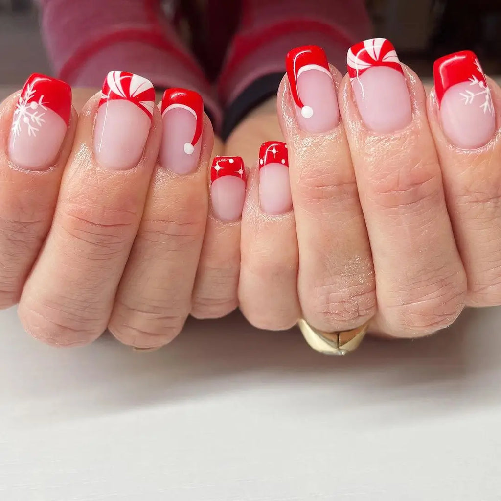 Glitter Red Tips with a Detailed Hat on the Ring Finger santa hat nail design