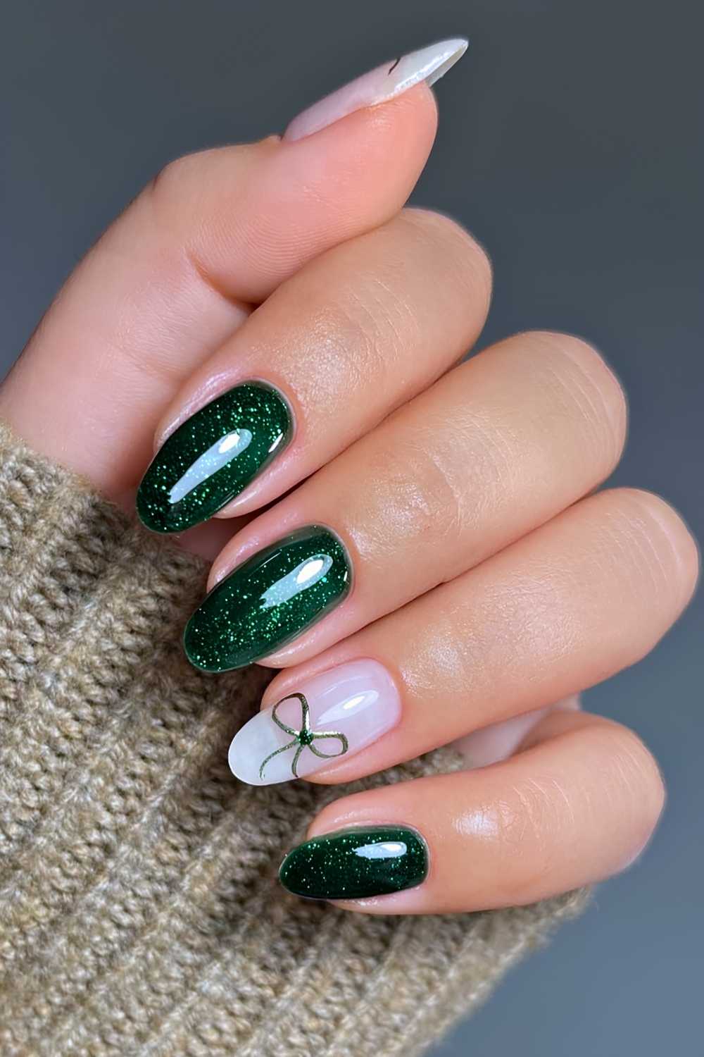 Green Glitter Nails with a Gold Coquette Bow green christmas nail design