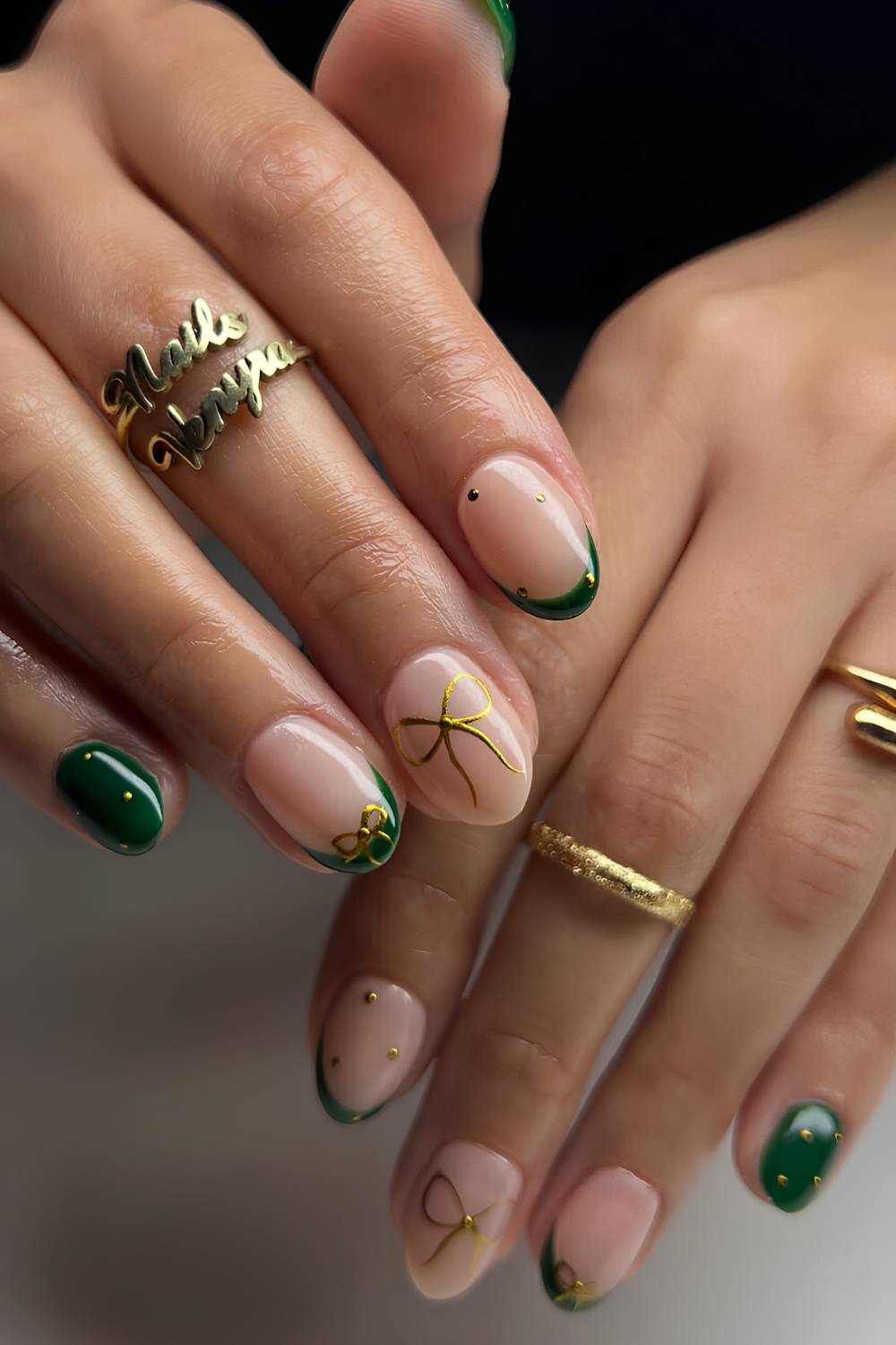 Short Green Nails with Gold Chrome Bows green christmas nail design