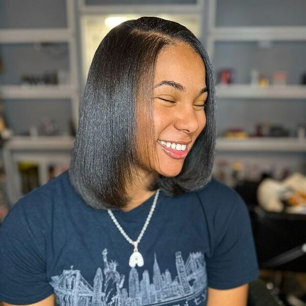 Shoulder-length cut with flipped face-framing layers silk press hairstyle