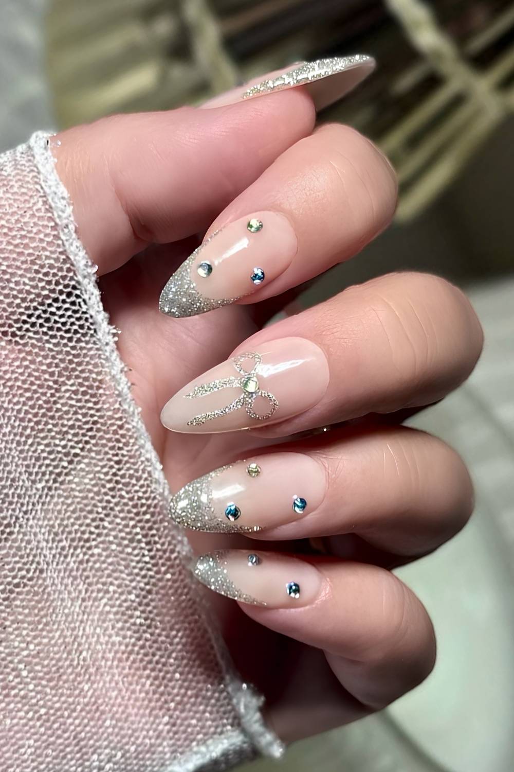 Silver Glitter French Tips with Coquette Bows and Blue Gems holiday nails