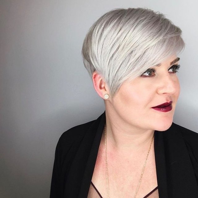 Silvery pixie swept deep to one side blonde short hair