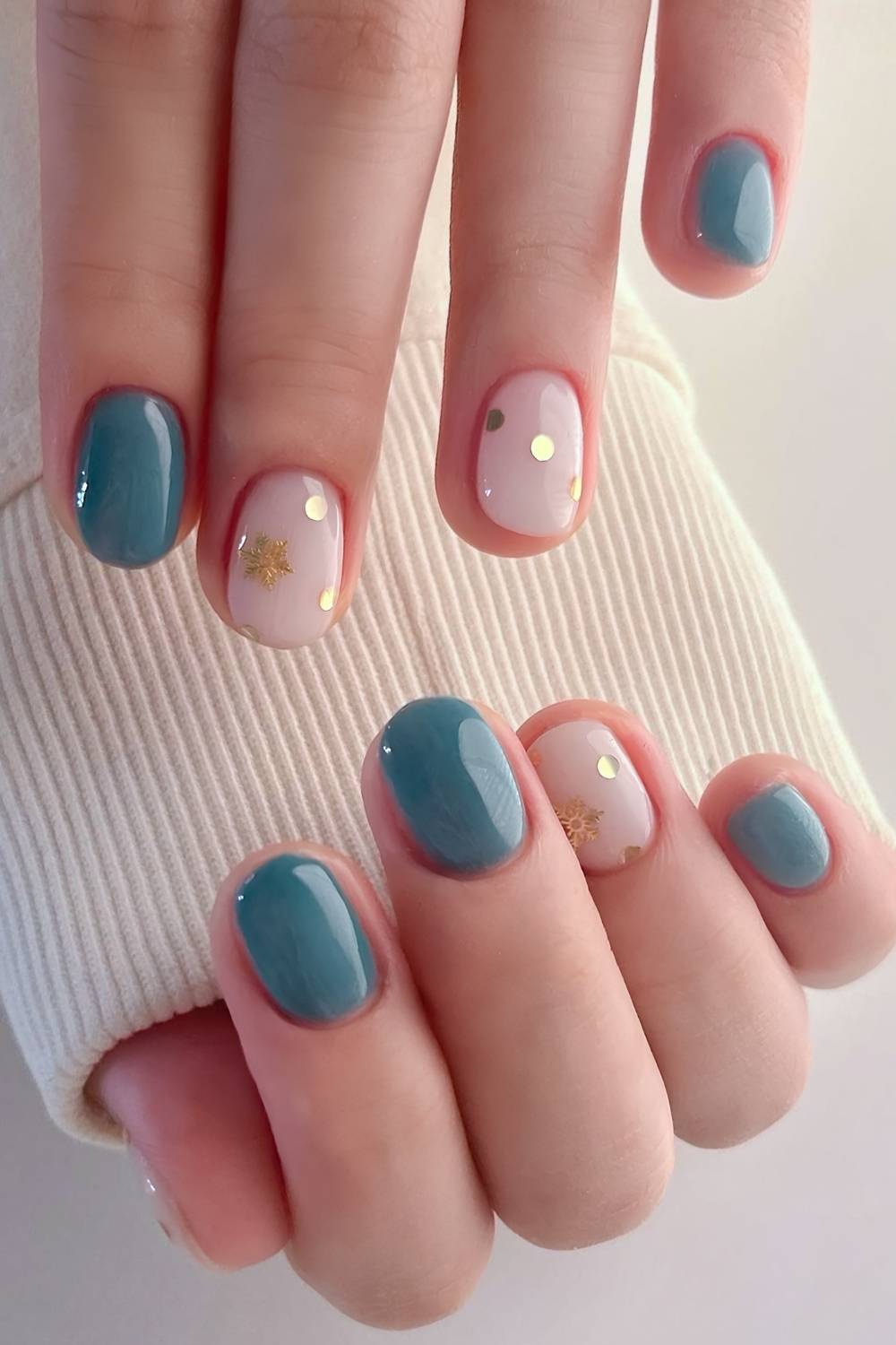 Soft Teal Nails with Snowflakes and Confetti green christmas nail design