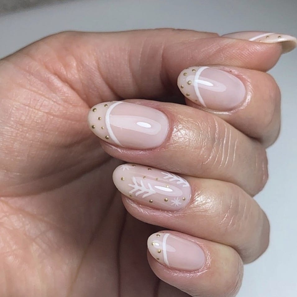 Gold Dots and a Snowflake on Sheer Nude subtle Christmas nail design