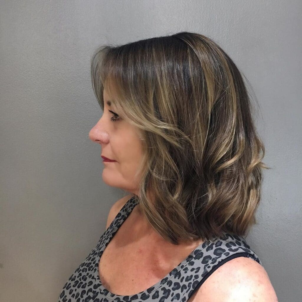 Shoulder-length wavy lob with soft body waves