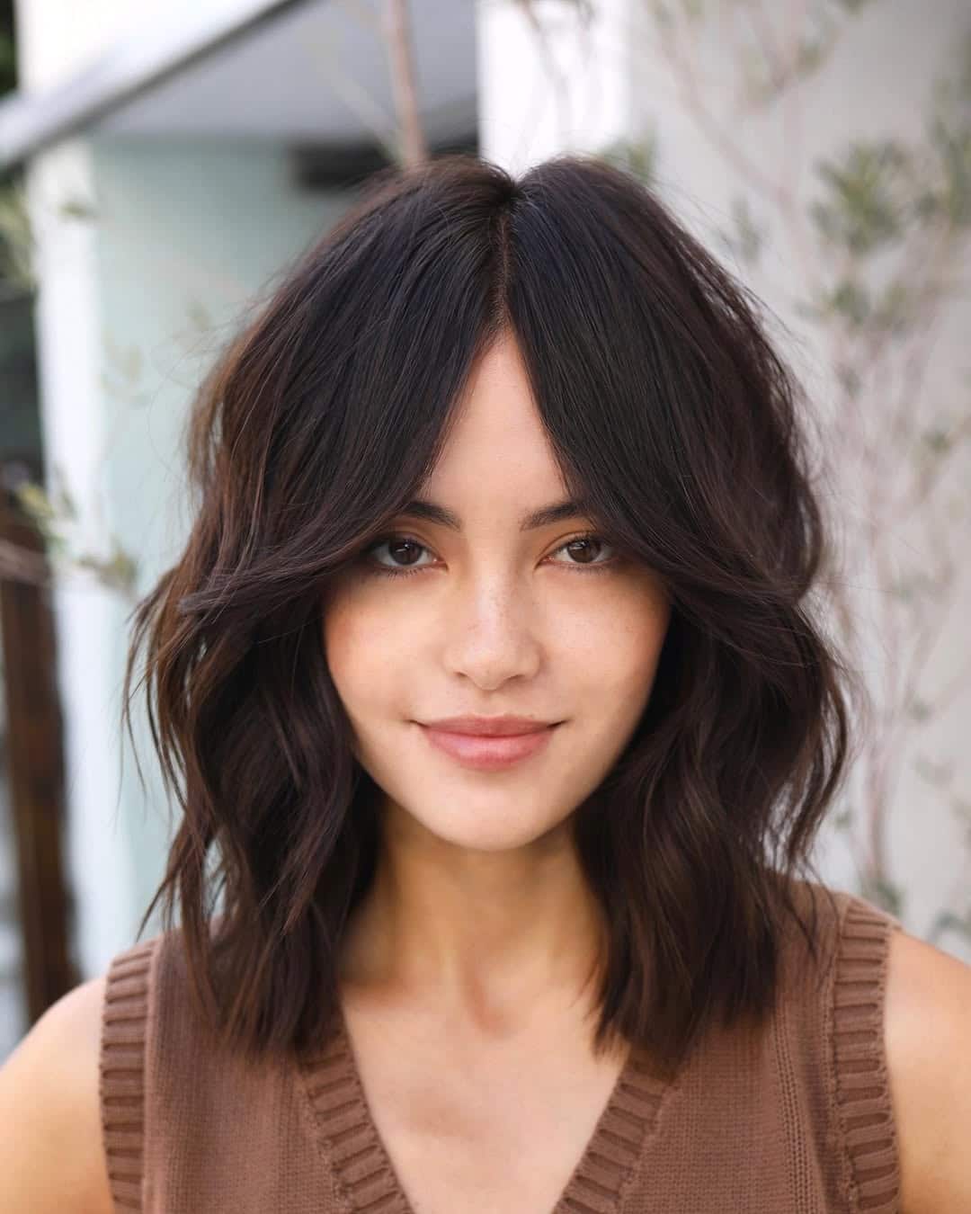 Wavy lob with flowing curtain bangs