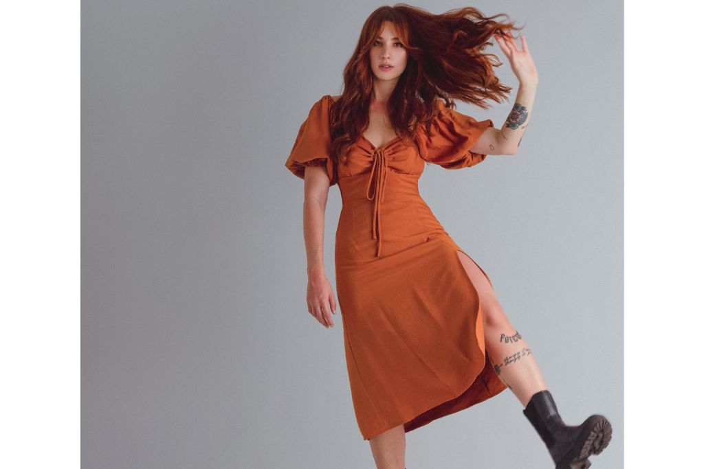 Midi dress with a coat for a West End evening in London