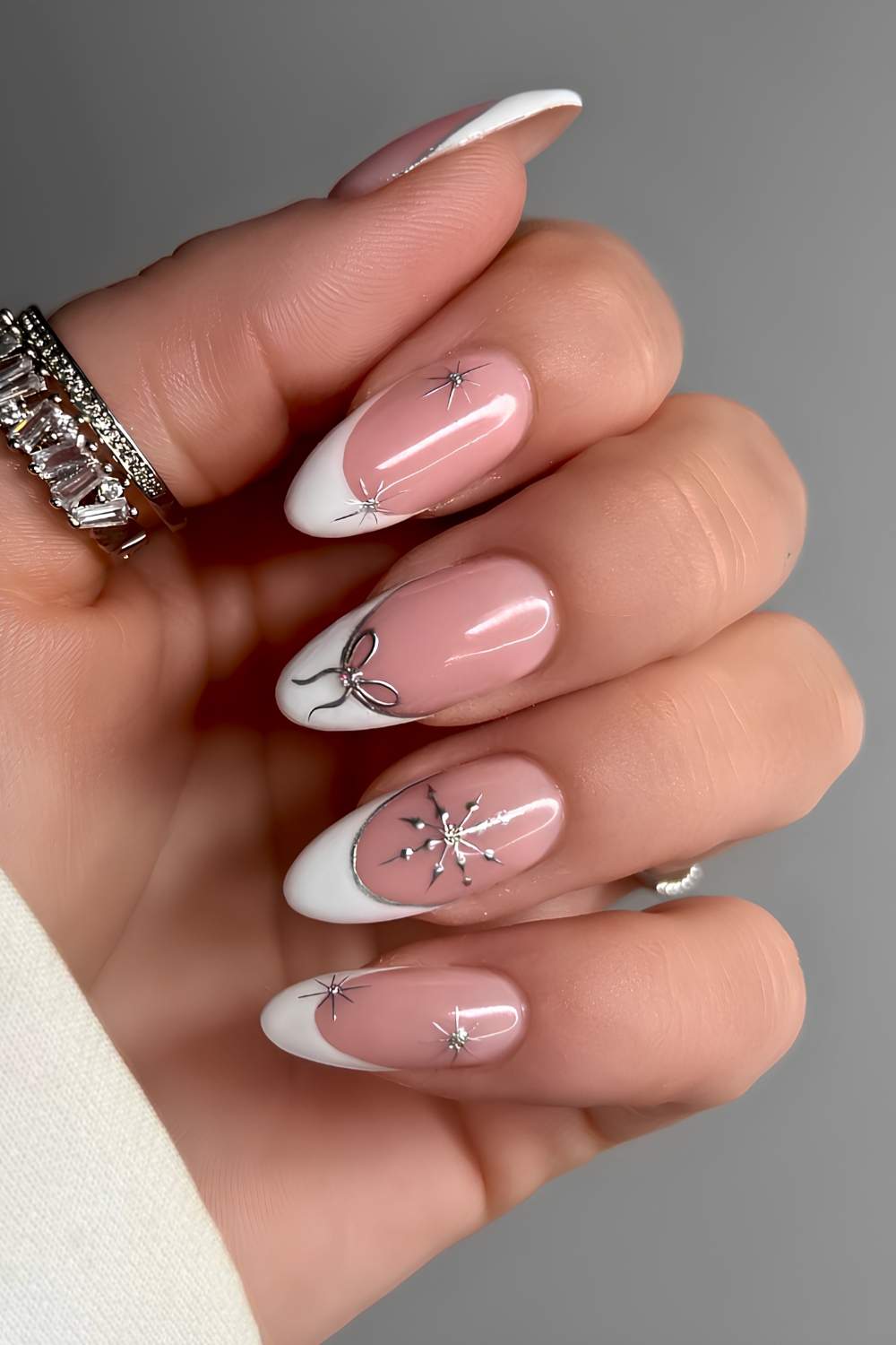 Metallic French with Bows, Flakes and Starbursts white Christmas nail design