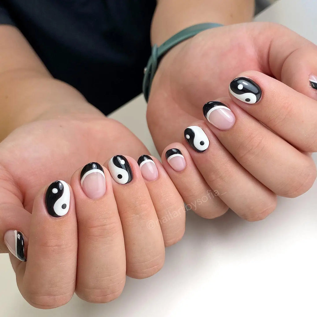 Yin yang black and white nail art design