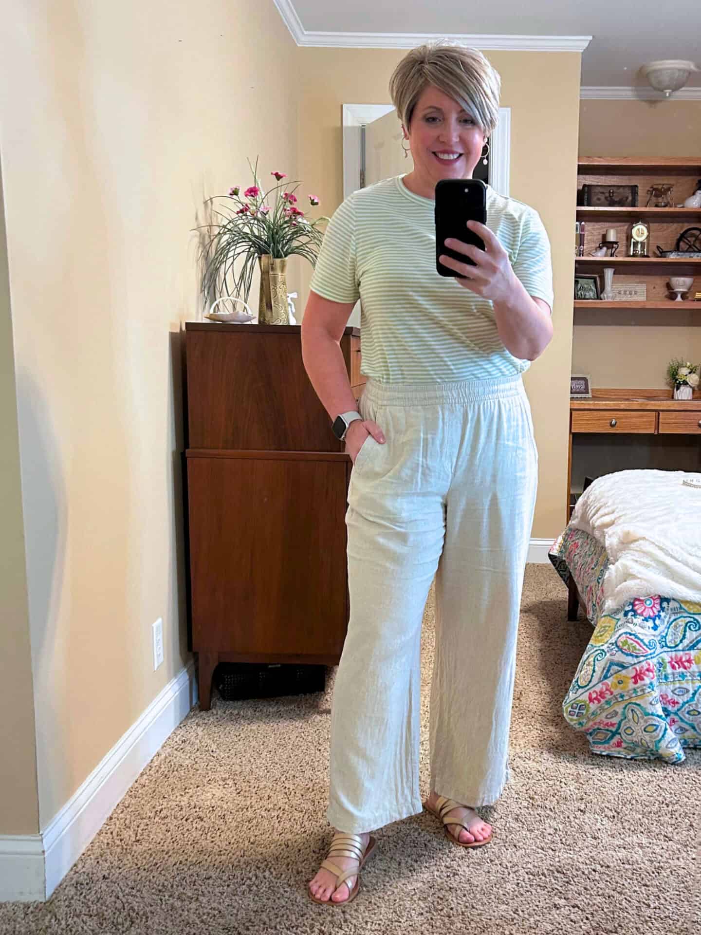 Pastel striped tee with neutral linen pants and gold sandals linen pants outfit