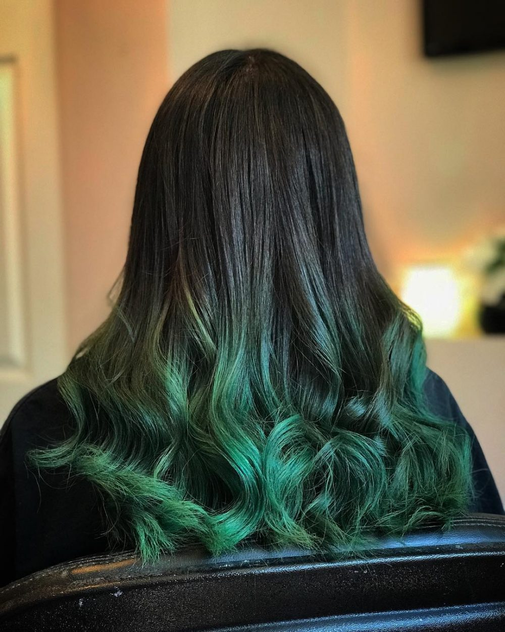 Emerald green money piece highlights on dark hair