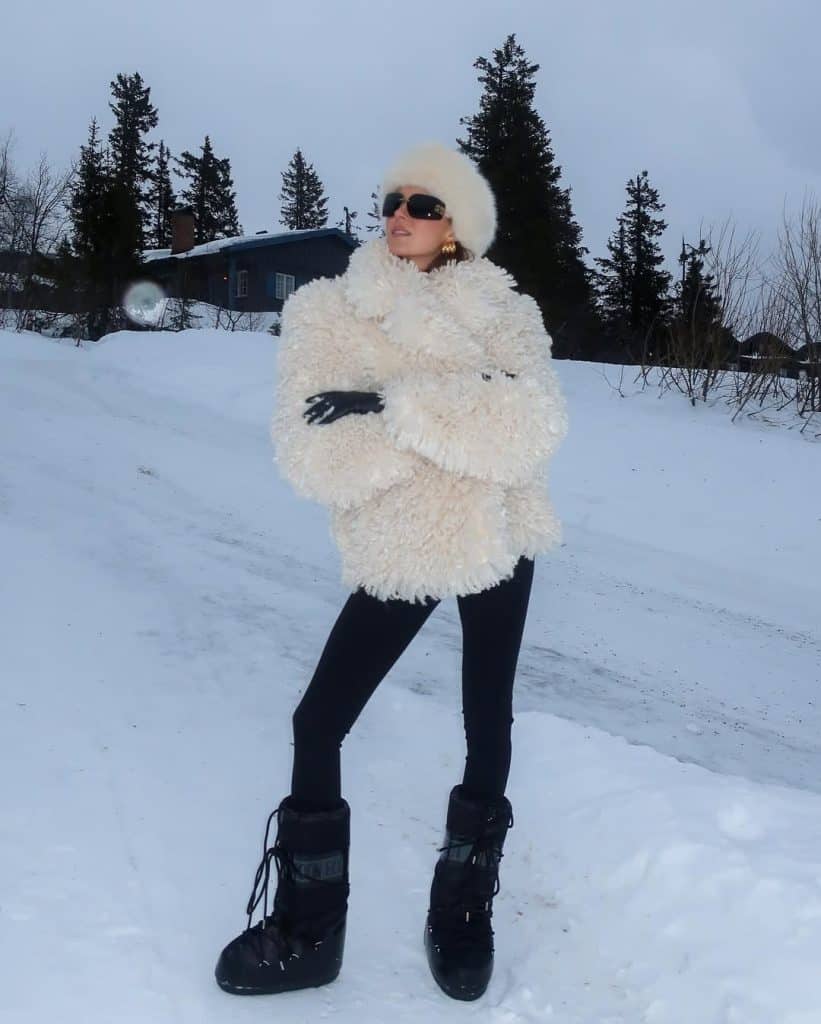 Plush Cream Coat Balanced by Black Flared Trousers apres ski outfit