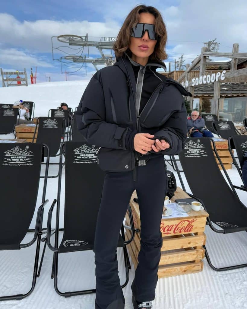 Long Chocolate Coat Over a Cream Patterned Cardigan apres ski outfit