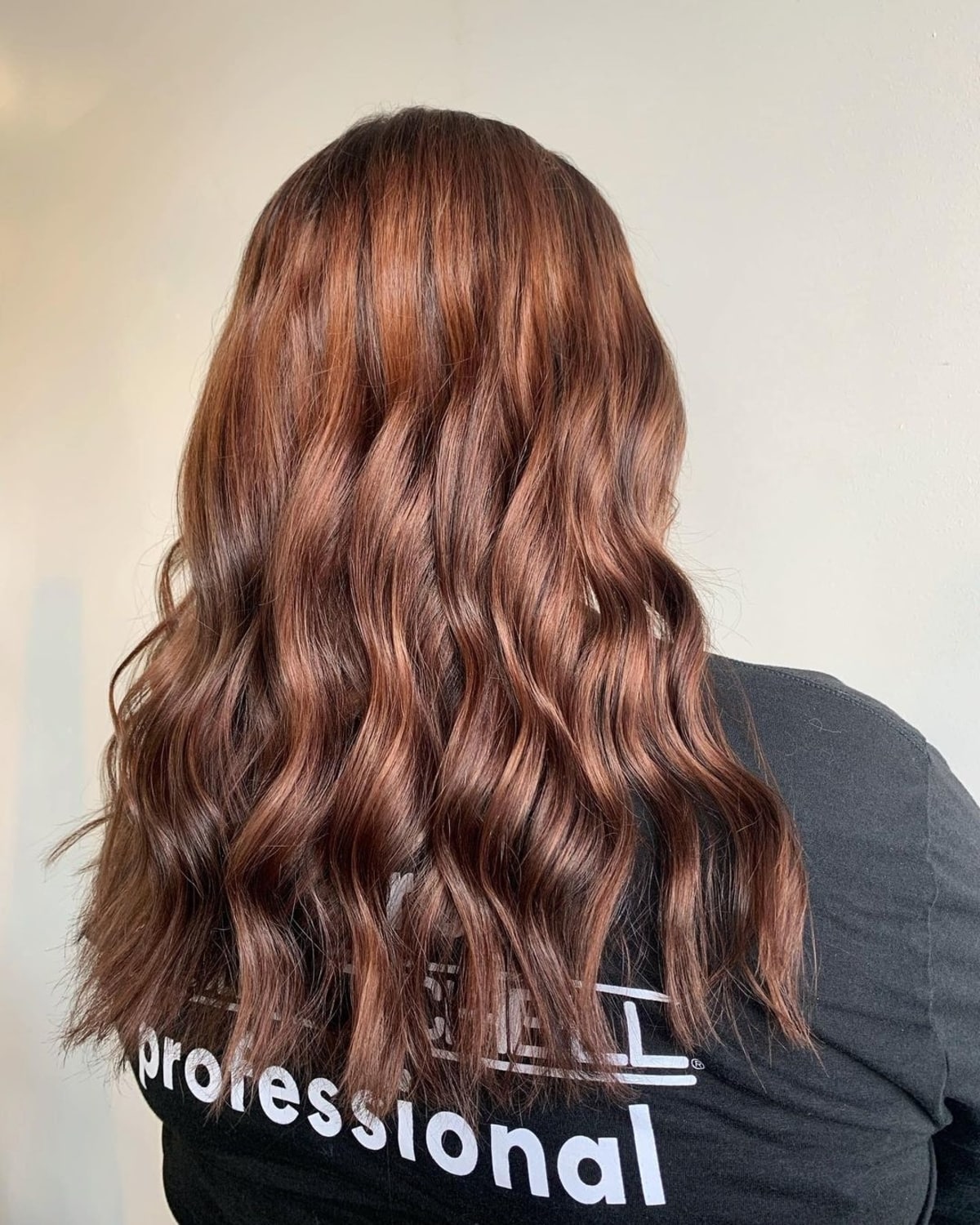 Auburn highlights adding warmth to dark brown hair