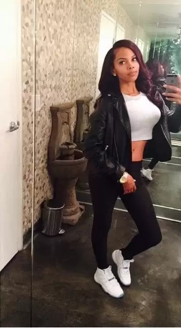 White Crop Top with a Leather Jacket and Black Jeans streetwear outfit