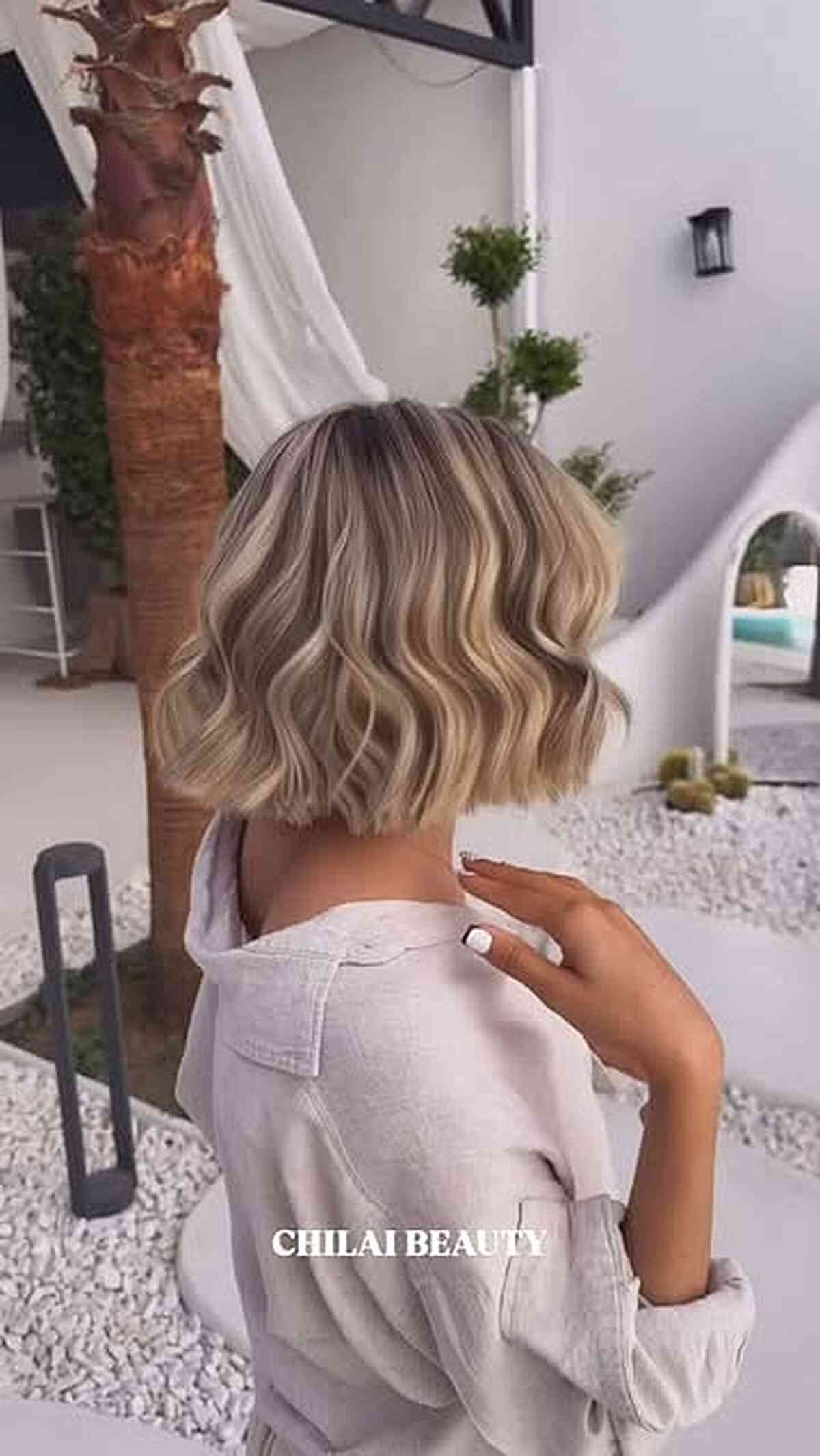 Soft-wave blonde balayage bob at shoulder length